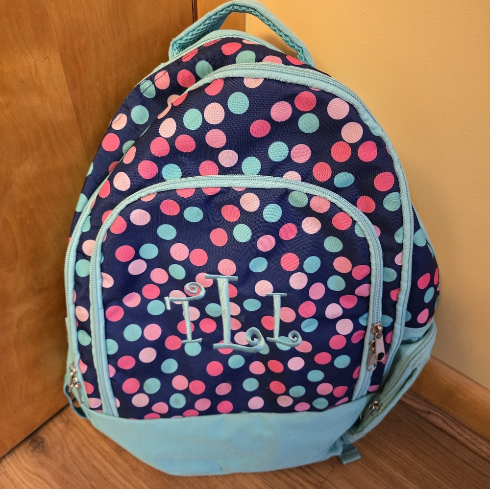 Long shot with this one, but Cute bookbag with 'TLL' initials
